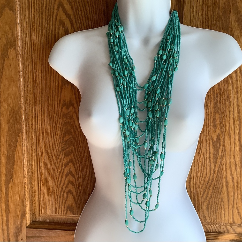 Turquoise colored beads, and gold , multi layered necklace